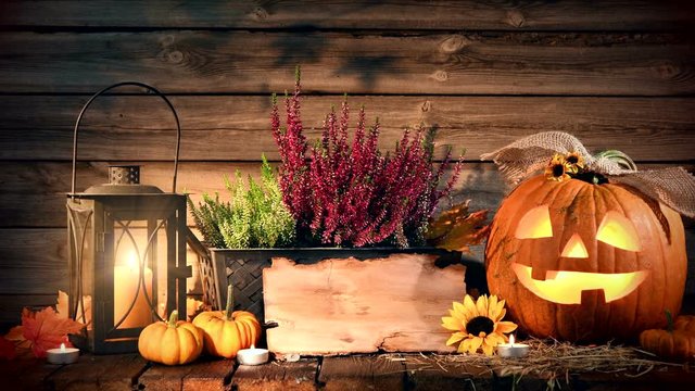 Halloween pumpkin head jack-o-lantern on wooden background