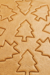 Christmas gingerbread cookies background. Christmas trees dough baking texture