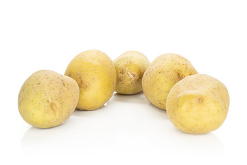 Group of five whole raw brown potato triangle isolated on white background