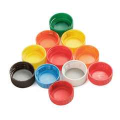 Colorful plastic bottle caps arranged in Christmas tree shape isolated on white background