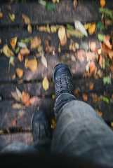 closeup of hiking boots in autumn woods