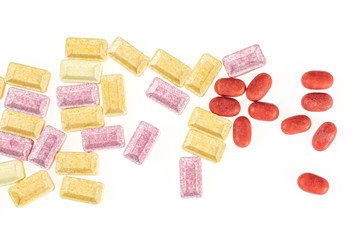Lot of whole sweet pastel candy heap flatlay isolated on white background