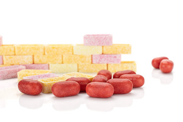 Lot of whole sweet pastel candy wall isolated on white background