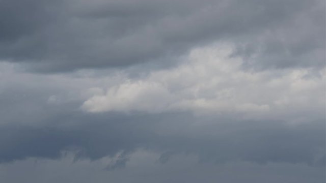 Gray Clouds moving in the Sky. Time Lapse.