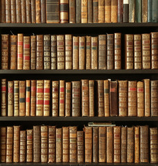 old books on wooden shelf