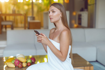 Young beautiful girl with a smartphone
