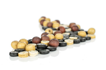 Lot of whole arranged wooden bead isolated on white wood