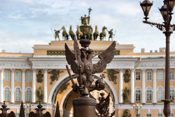 Sculpture eagle in crown, symbol of imperial Russia in front of palace