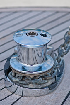 Stainless steel yacht capstan on wooden deck