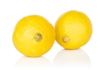Group of two whole fresh yellow lemon isolated on white background