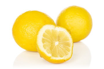Group of two whole one half of fresh yellow lemon isolated on white background