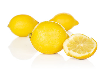 Group of three whole two pieces of fresh yellow lemon isolated on white background