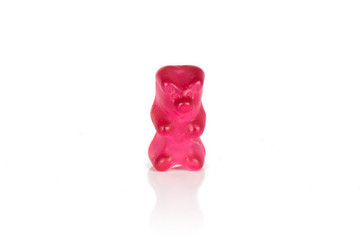 One whole red gummy bear isolated on white background