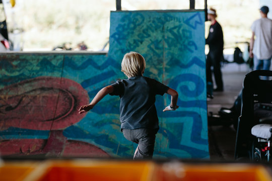 Kid Running In The Skate Park