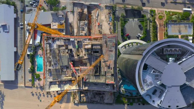 Direct overhead footage of highrise towers on the beach shot with aerial drone 4k