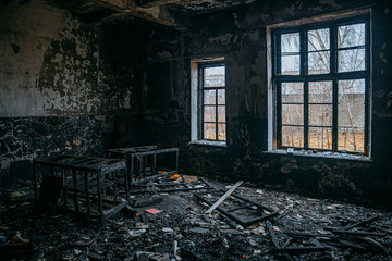 Burned interiors after fire in industrial or office building. War or fire consequences concept