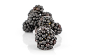 Lot of whole fresh black blackberry isolated on white background