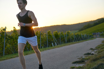 young jogger in sunset