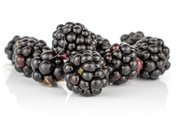 Lot of whole fresh black blackberry stack isolated on white background