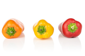 Group of three whole fresh pepper isolated on white background