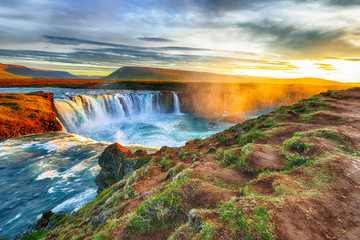 Fantastic sunrise scene of powerful Godafoss waterfall.