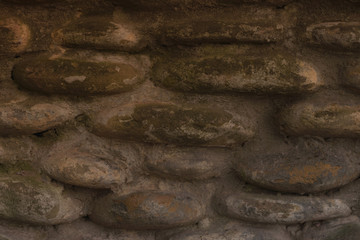 Stone Texture. Abstract texture of a stone wall. Gray stone background. Retro style. Textured surface. Facade, building details. Mosaic of stones. Gray grunge surface. Natural pattern.