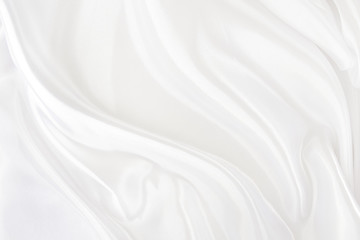 Obraz na płótnie Canvas White fabric texture that is white silk background with beautiful soft blur pattern.