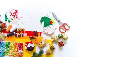 Fototapeta na wymiar Craft soft toy decor for Christmas tree elf felt. Copy space Banner