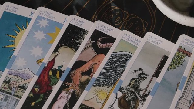 Slow pan across tarot cards on table