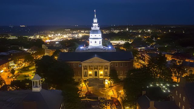 Aerial hyperlapse of Annapolis at dusk. Annapolis is the capital of the US state of Maryland and the county seat of Anne Arundel County. The drone rotates around the Maryland state house.