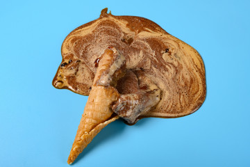 top view coffee flavor ice cream cone melted on a blue background