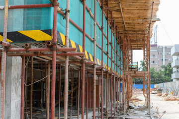 scaffolding and protection netting on an unfinished building