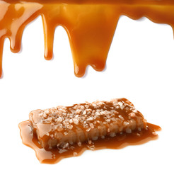 Stains of liquid caramel on white background
