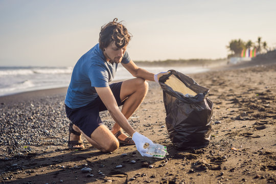 Young Man Cleaning Up The Beach. Natural Education Of Children