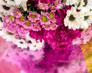 bouquet for a holiday, birthday of many chrysanthemums on a blurred reflective background
