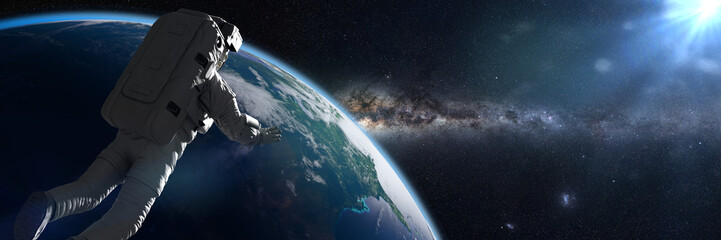 astronaut in orbit of planet Earth © dottedyeti