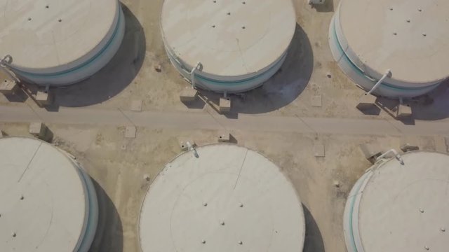 Storage silo tanks in the desert (4K)