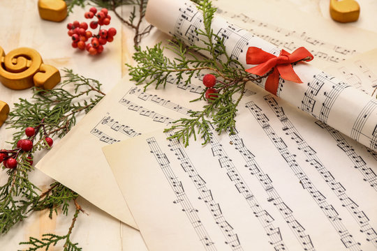 Christmas composition with music notes on table