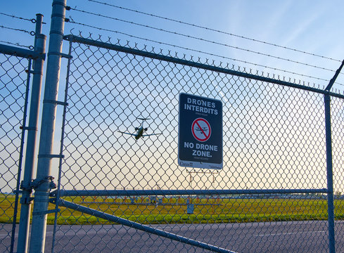 No drones zone sign and airplane