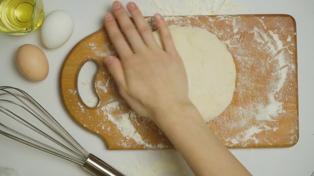 Video of rolling pin and dough on the table