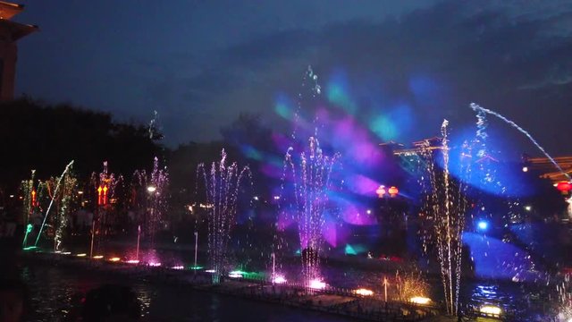 Amazing light and sound show in the fountains in the central town square at dusk in Xian, China