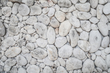 Small stones white and black construction industry material nature White pebbles placed on the floor Stone texture and background