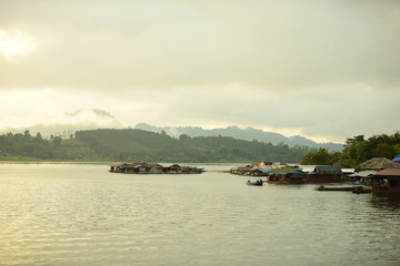 View of the river and surrounding communities of the dam near the Mon Bridge at Khao Laem Dam, Sangklaburi, Thailand.