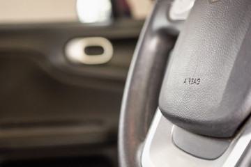 Obraz premium Safety airbag sign on car steering wheel