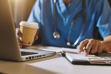 Medical technology concept. Doctor working with mobile phone and stethoscope and digital tablet...