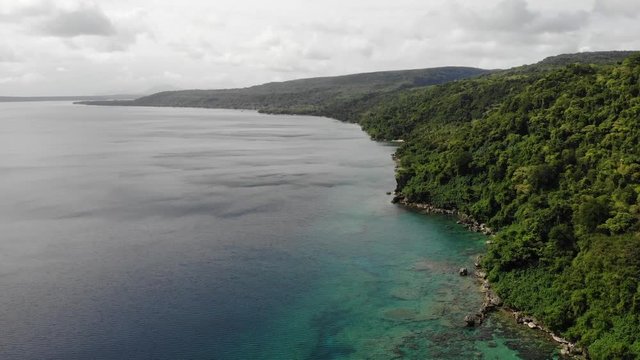 aerial view of a tropical island with clear water in Vanuatu, South pacific