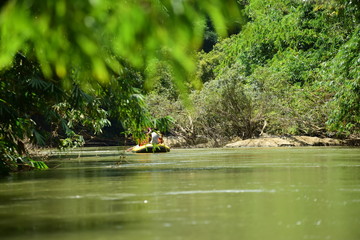 Fototapeta na wymiar Group rowing on river