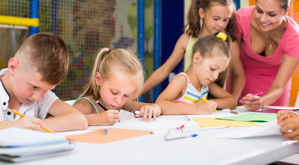 Fototapeta premium Children drawing on lesson in elementary school class