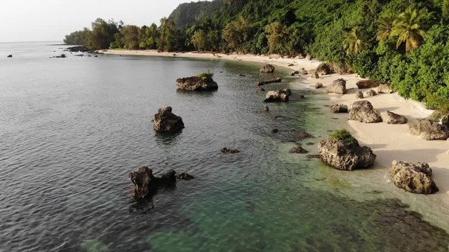aerial view of a tropical island with clear water and palm trees in Vanuatu, South pacific