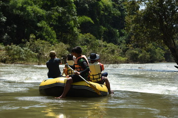 Group rowing on river